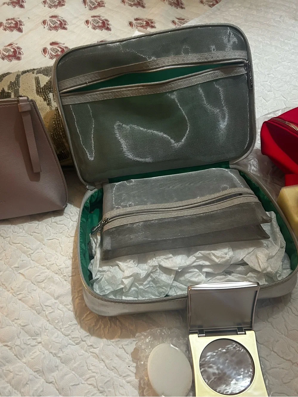 Clinique moisturizer & metallic travel bag plus Elizabeth Ard medium bronz.&bag
